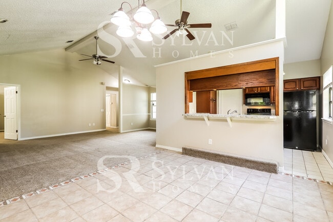 Building Photo - The living is easy in this 4 bedroom, 2 bathroom home