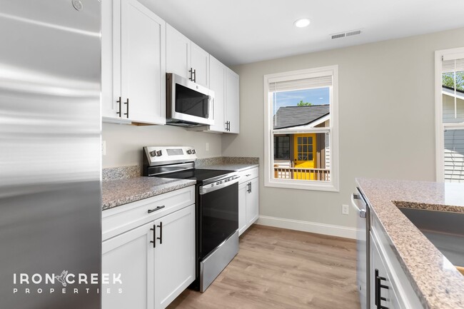 Building Photo - Bright and Modern: New Construction Three-...