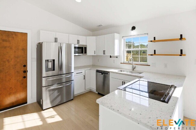 Building Photo - Beautiful Like-New 3 Bedroom Home with Huge Fenced Yard, Greenhouse & Storage