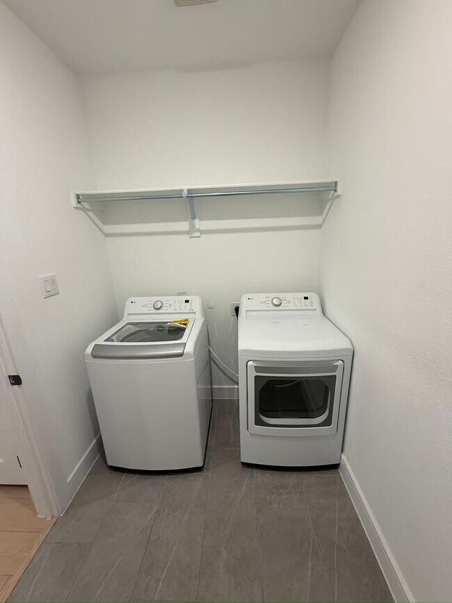 Building Photo - Move-in ready and like-new! Washer, dryer, and refrigerator Included.