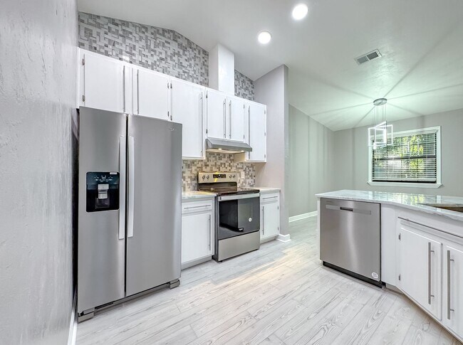 Building Photo - MODERN & Redone 1/1 w/ Tile Floors Throughout, Stainless Appliances, Granite Counters, Washer/Dry...