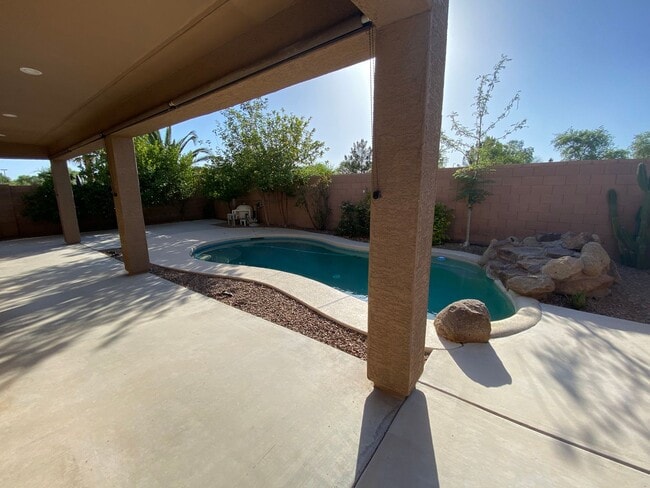 Building Photo - Prime Power Ranch Retreat: 4BR/2.5BA Oasis with Private Pool, Vaulted Ceilings & Backyard Bliss!