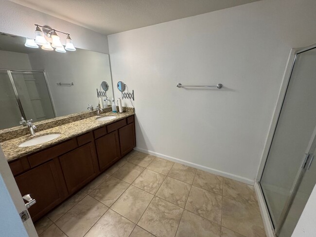 Building Photo - Lake Views. Upgraded Finishes. Gated Commu...