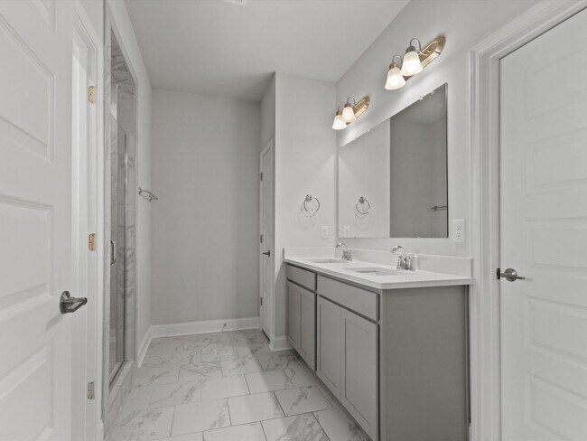 Building Photo - 3 Car Garage! Modern end-unit townhome located in the desirable Clift Farm!