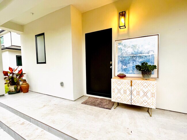 Entrance with patio - 4206 Pomona Ave