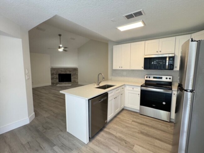 Building Photo - Fully Remodeled 2 Bedroom w/ Lawn Care &am...