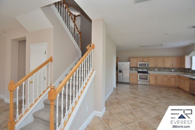 Building Photo - SPACIOUS, FULLY FENCED 4/2.5/2 IN DESIRABLE MATANZAS WOODS