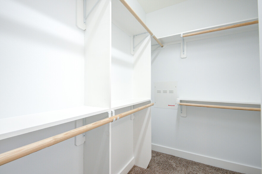 Spacious walk-in closet. Additional shelving not pictured. - 4202 Spencer St