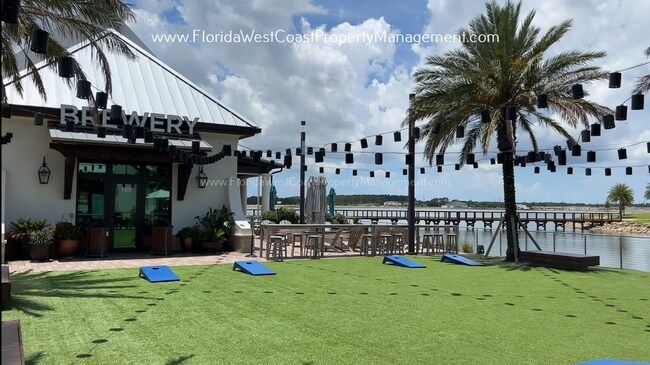 Building Photo - EXCEPTIONAL AND SPACIOUS FURNISHED TOWNHOME WITHIN WATERSIDE- NAUTIQUE!