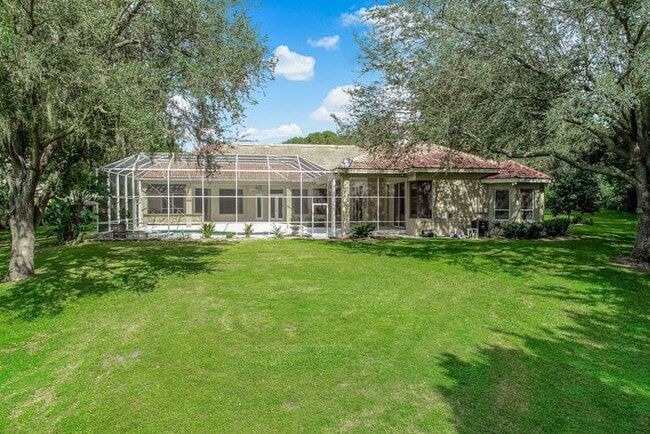 Building Photo - Stunning 5-Bedroom Pool Home on Nearly 2 A...