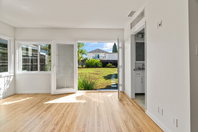 Large ensuite master bedroom looking at newly planted back yard - 2451 22nd St