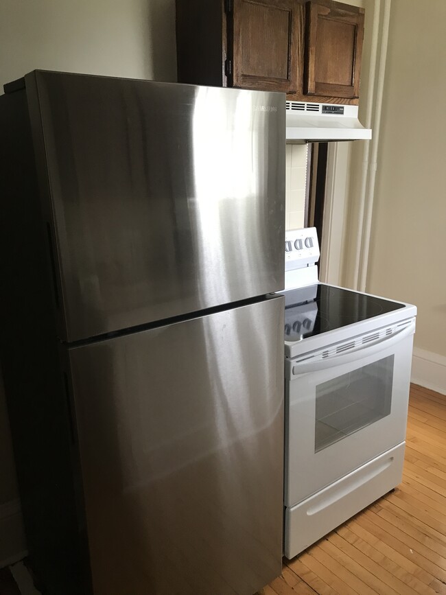 Stainless steel fridge and modern glass top stove - 1145 Jessie St