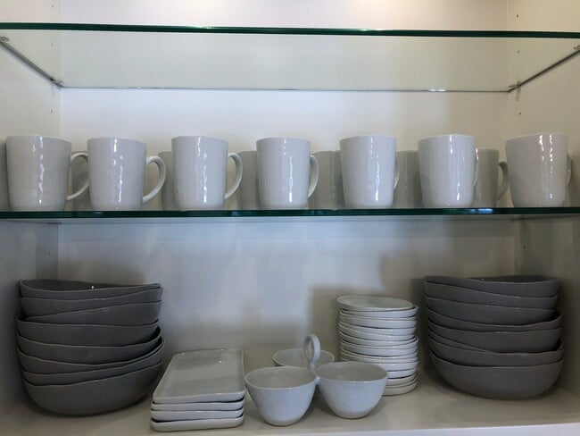 Service for 8 from Crate and Barrel with many coordinating different-size pieces and serve ware. - 8437 N 84th St