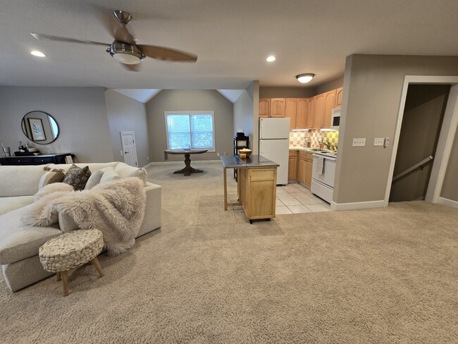 Kitchen and dining area shown - 5040 Postlewaite Rd