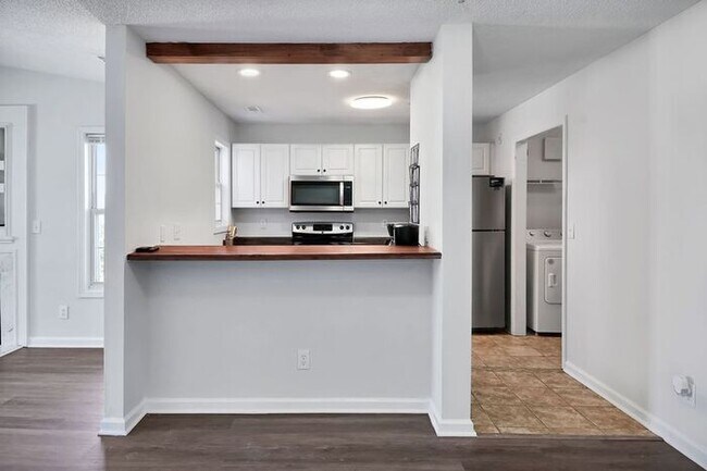 Building Photo - RENT SPECIAL! Freshly Painted! New Luxury Vinyl Plank Floors! Updated Lighting! Pool View Unit! C...