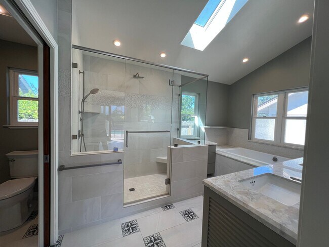 Building Photo - Spacious 4-Bedroom Retreat Just Steps from...