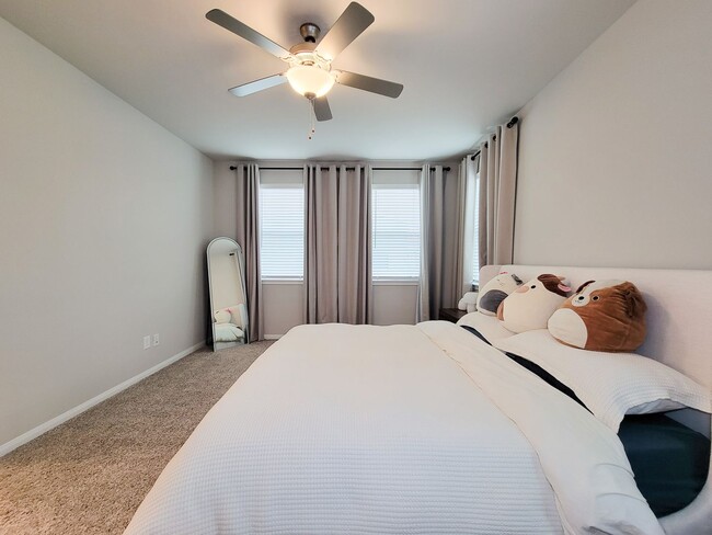 Building Photo - A true gem on a quiet corner lot, this spacious and sun-filled home is tucked away from street no...