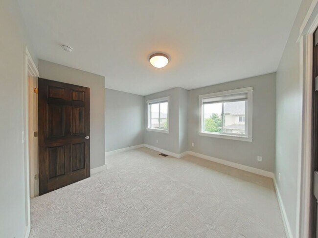Building Photo - Stunning 3-bedroom, 2.5-bathroom condo with attached 2 stall garage!