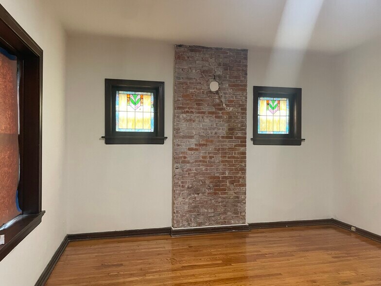 Original stained glass windows and brick - 4024 Tholozan Ave