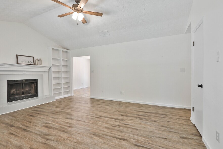Living Room w/ Fireplace and Built-in Bookshelves - 37 Seven Pines Cir
