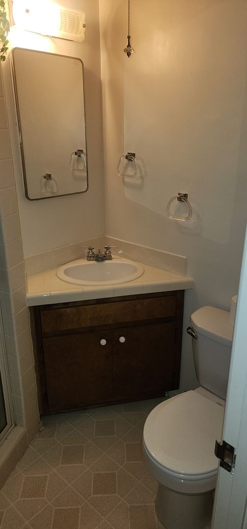 Building Photo - This is a spacious house featuring four bedrooms and two bathrooms, along with a two-car garage.