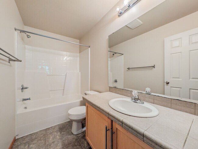 Building Photo - Move in ready 4 bed, 2.5 bath home W/ New Paint & Carpet!