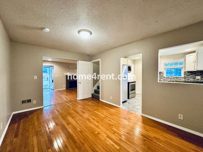 Building Photo - Adorable Home Featuring Wood Floors, SS Ap...