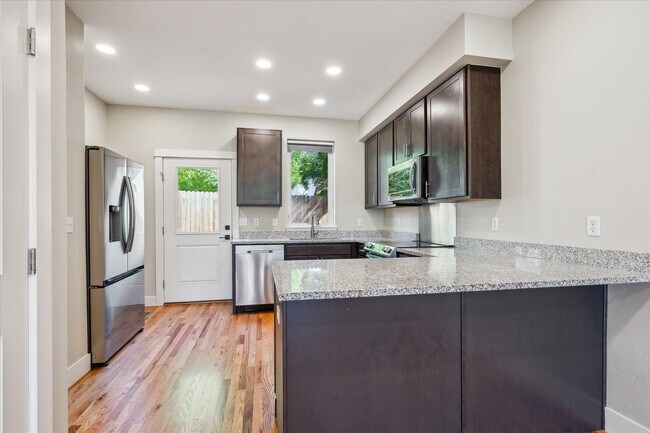 Building Photo - Modern 4-Bedroom Townhome with Rooftop Deck Near Sloan’s Lake & Light Rail