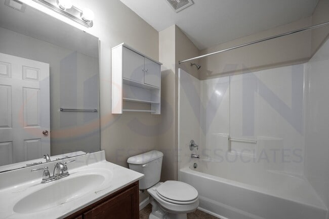 Building Photo - Welcome to this spacious 4-bedroom, 2.5-ba...