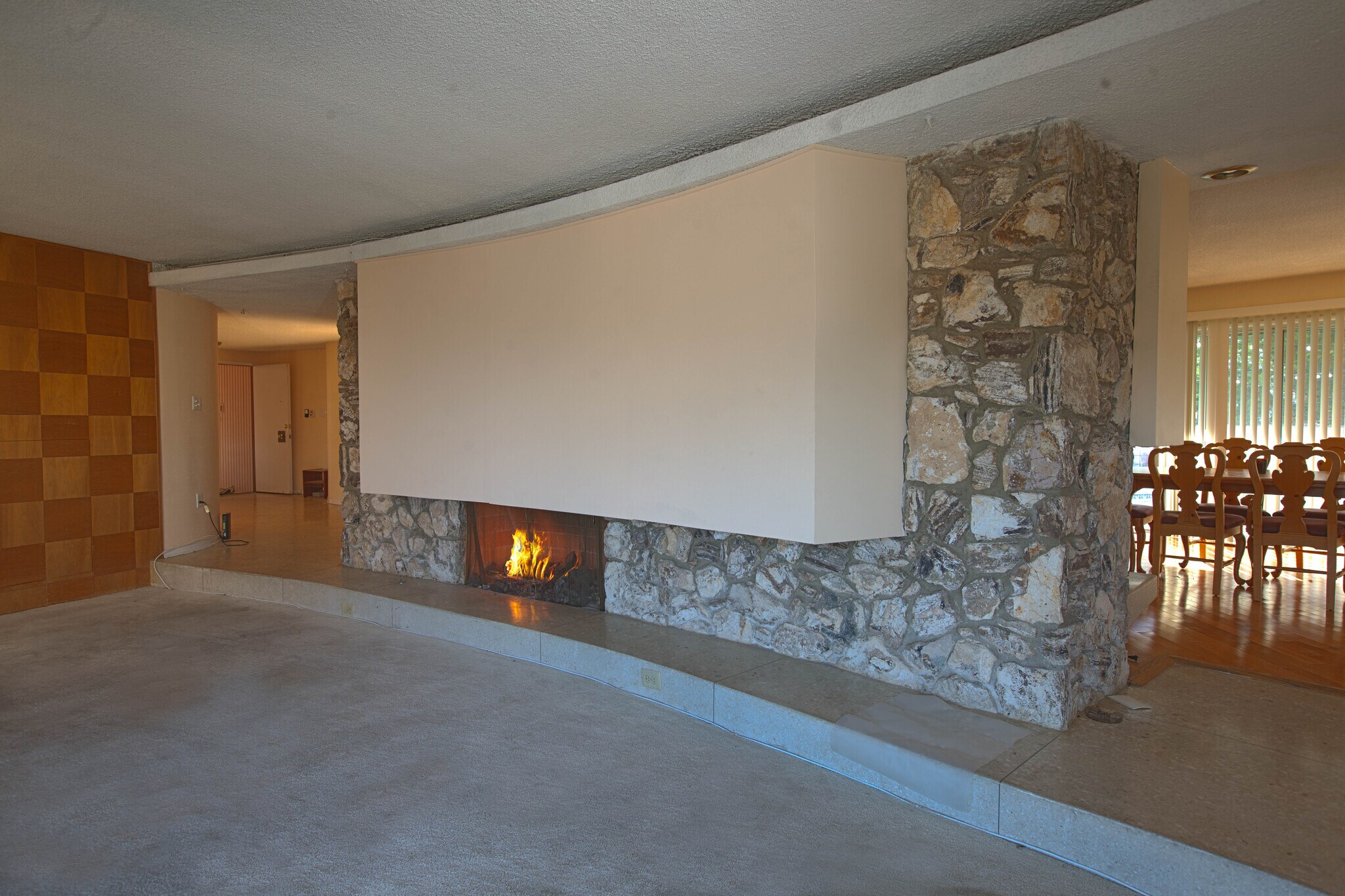 Living room with one of two fireplaces. - 3903 Carol Court