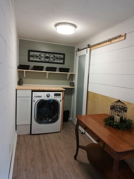 Guests unit has a LG washer/dryer combo. - 19918 Damson Rd