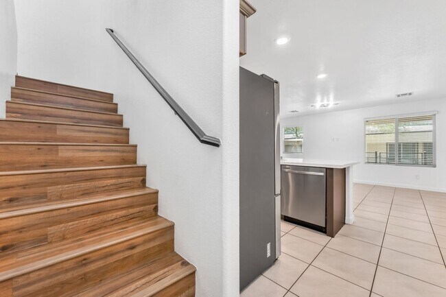 Building Photo - Modern Gated Townhome with Flexible Living Spaces & Stylish Finishes!
