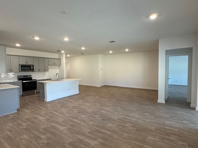 Building Photo - BRAND NEW 4 BR / 2 BA with THREE-CAR GARAG...