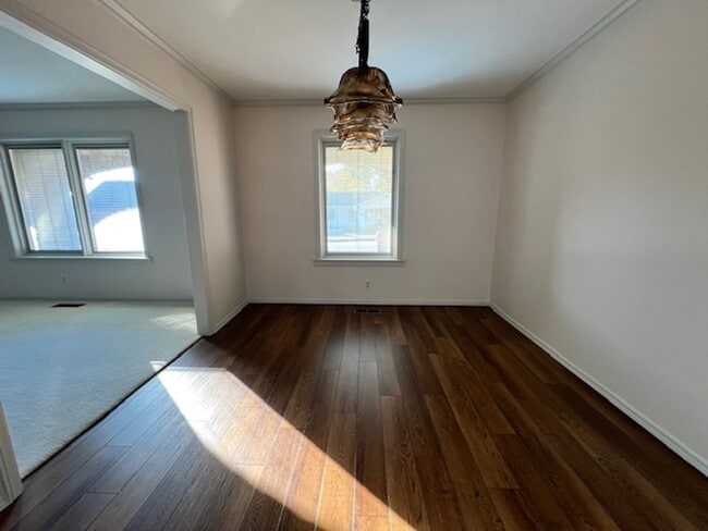 Building Photo - Step into this inviting, sunlit home where space and comfort blend seamlessly