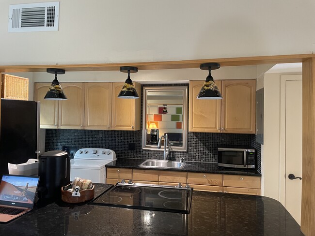 Kitchen from living room - 501 E Bay Dr