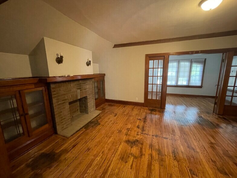 Living room with fireplace and woodwork - 2777 N 48th St
