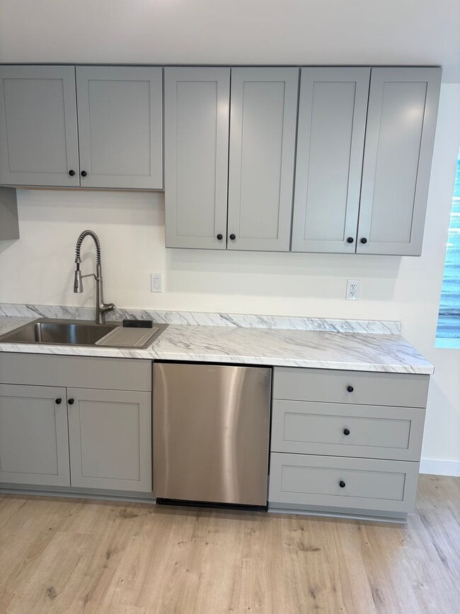 Building Photo - NEWLY RENOVATED 2 bed/ 1 bath Basement Apartment for Rent – All Utilities Included