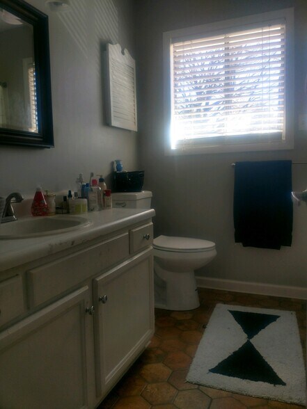 Upstairs full bathroom with recently recoated tub. - 3620 Burt Dr