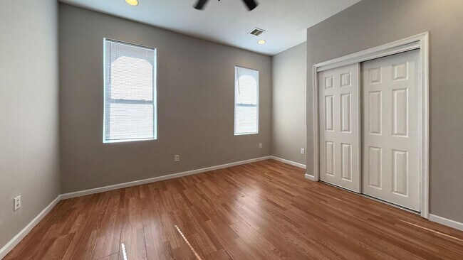 Building Photo - Charming 4BR/2BA Rowhouse with Hardwood-Style Flooring Throughout