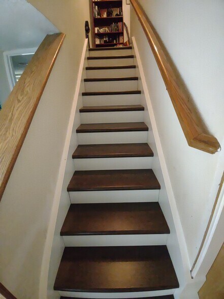Stairs to the bedrooms and laundry downstairs - 12061 Pleasant Way