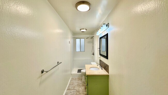 Building Photo - Sweet ground floor 1 Bedroom with a Sunny Wrap Around Deck and In-Unit Washer & Dryer