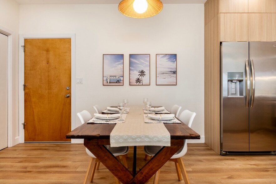 Inviting dining area with seating for four and warm pendant lighting - 2221 Ocean Ave