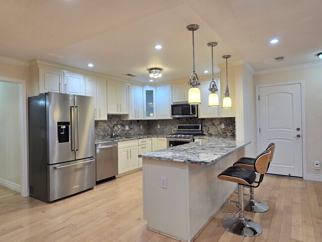 Building Photo - Beautifully Remastered Duet Home, Completely Renovated, A/C, Breakfast Bar, SS Appliances, W/D, W...