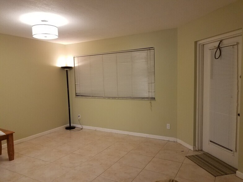 Open living room area, next to kitchen. Living room has mini-blinds that can be closed for privacy. - 550 S Park Rd