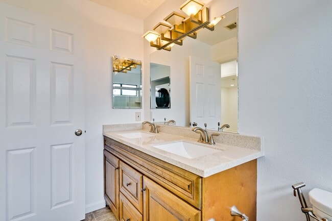 Building Photo - Spacious condo available in desirable Newpark Village community!