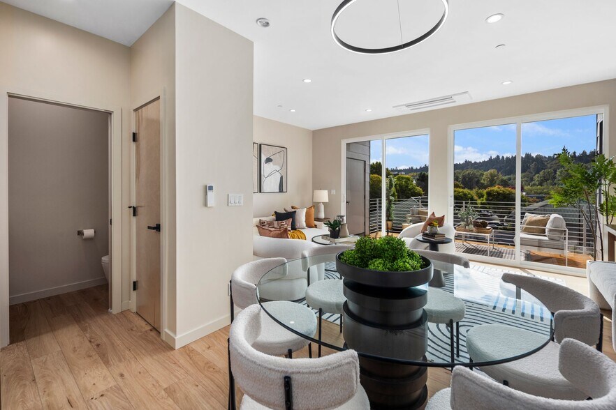 View to powder, pantry, dining, living room, and deck beyond - 10120 NE 185th St