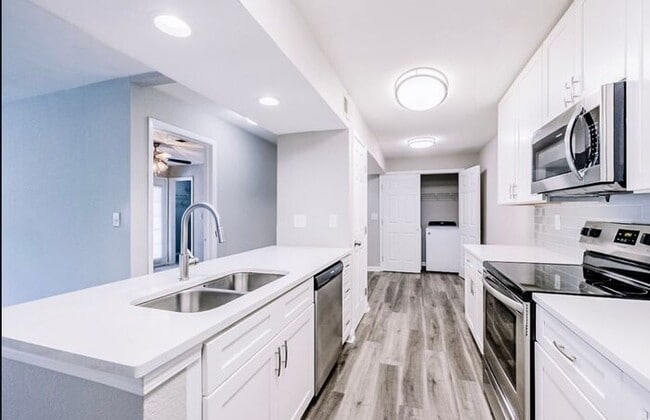 Building Photo - Spacious 2-Bedroom Elite Apartment with Private Balconies & Washer/Dryer