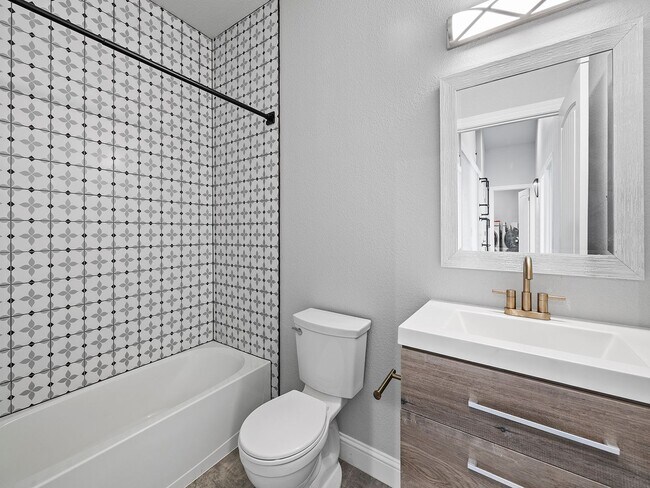 Building Photo - 4-Bedroom Townhome with Finished Basement, Garage & Private Outdoor Space