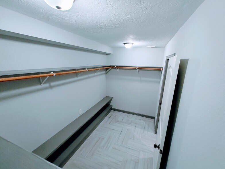 Huge walk-in closet and double custom shoe shelf running entire length of closet - 2 Arnica Ct