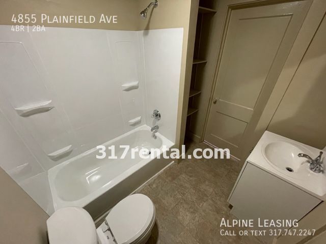 Building Photo - 4/2 with huge 2-car garage/workshop combo ...